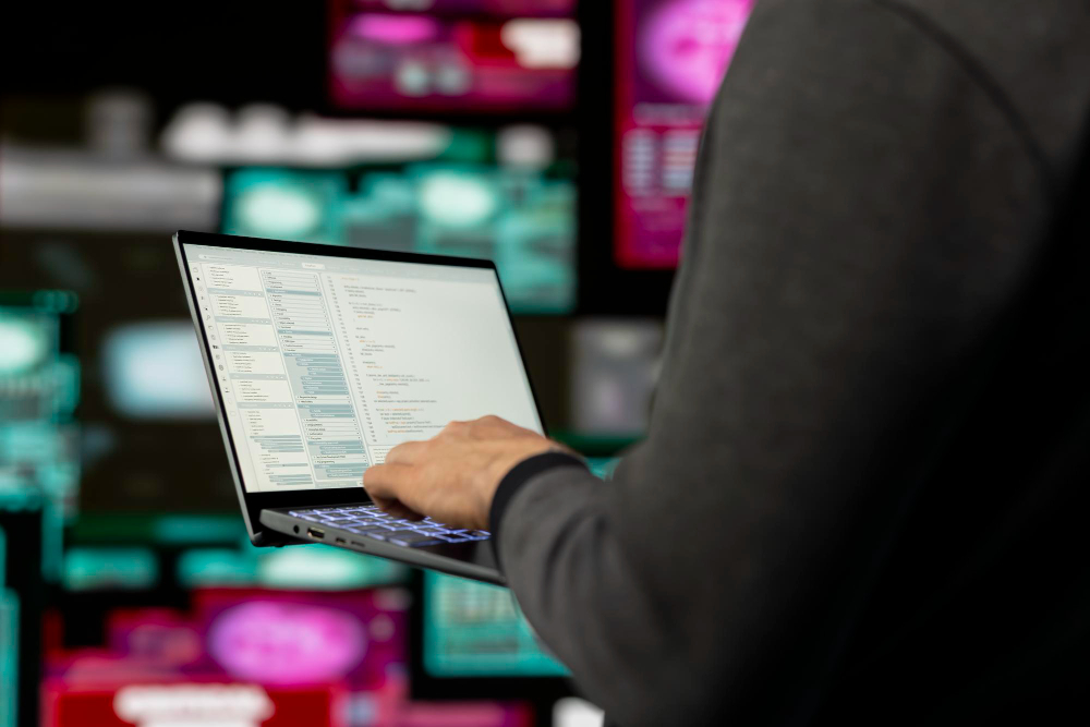 Person using a laptop to manage online data, aiming to remove search results from Google effectively