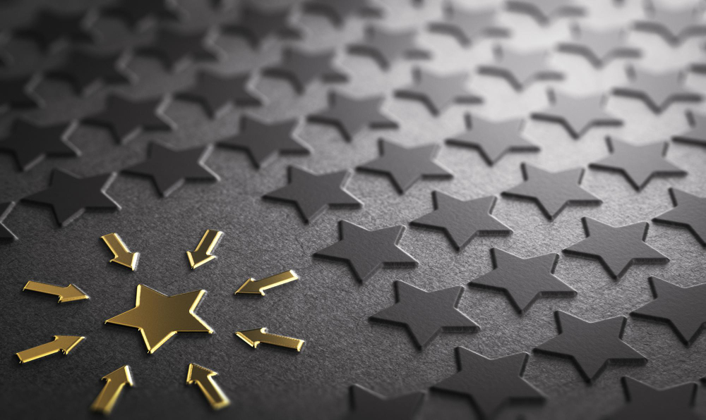 Golden star standing out among black stars symbolizing excellence through job reputation management