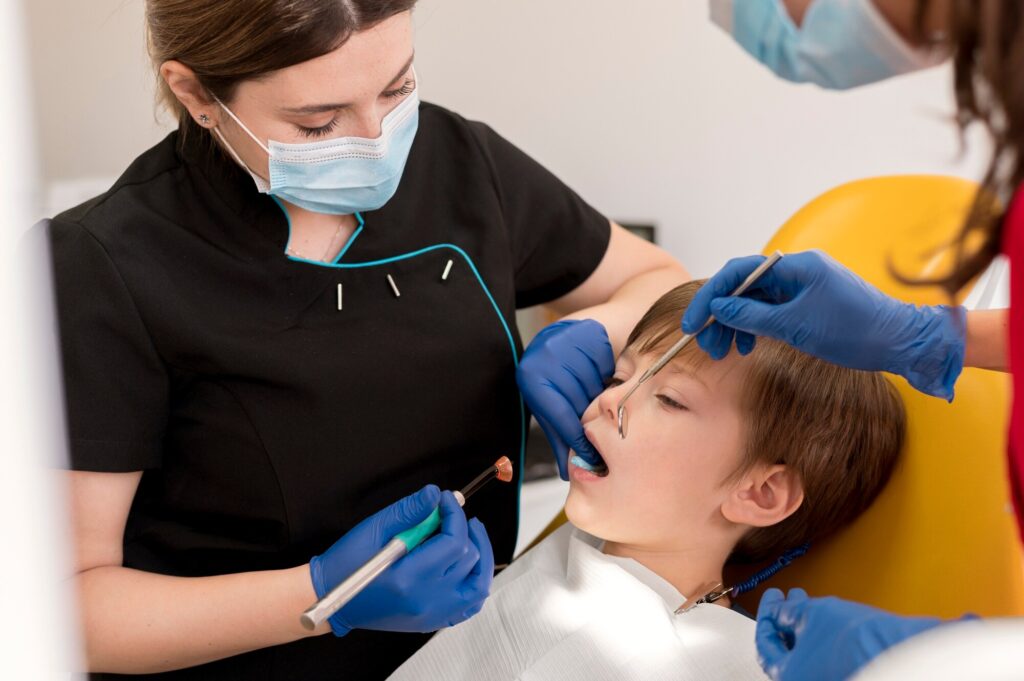 dentist cleaning child s teeth 23 2149195902