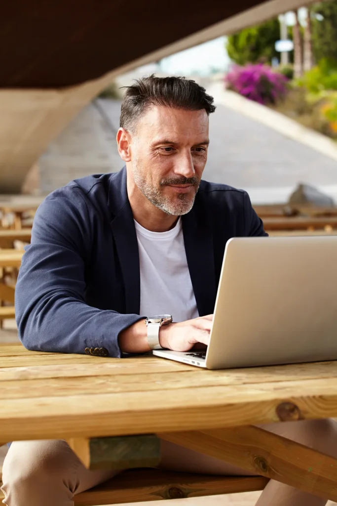 person reviewing a mugshot removal request on a laptop