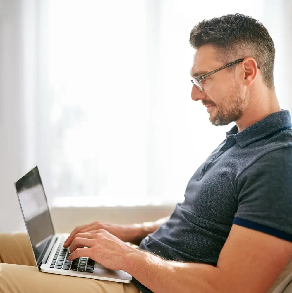 man sitting on a laptop 1